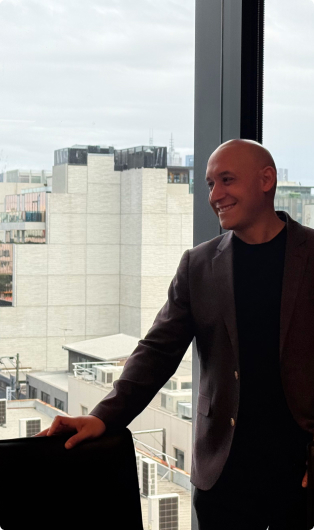 Real estate headhunter in Sydney crossing the road in a busy urban setting, representing professional talent acquisition and executive recruitment within the Australian real estate industry.
